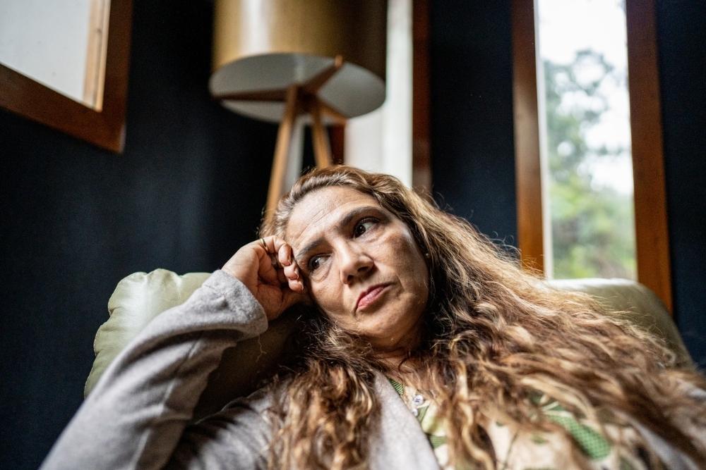 Sad mature woman contemplating at home