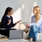 Miramont-Dialectical-Behavioral-Therapy-vs.-CBT. A therapist and her client sit in a well-lit room talking